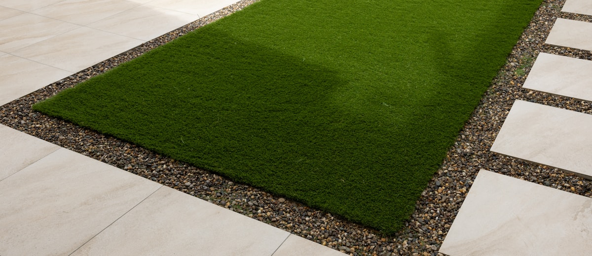 Pet turf with clean edges and perforated drainage backing