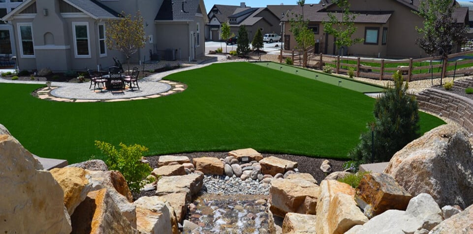 Clean artificial turf front yard — HOA-friendly installation